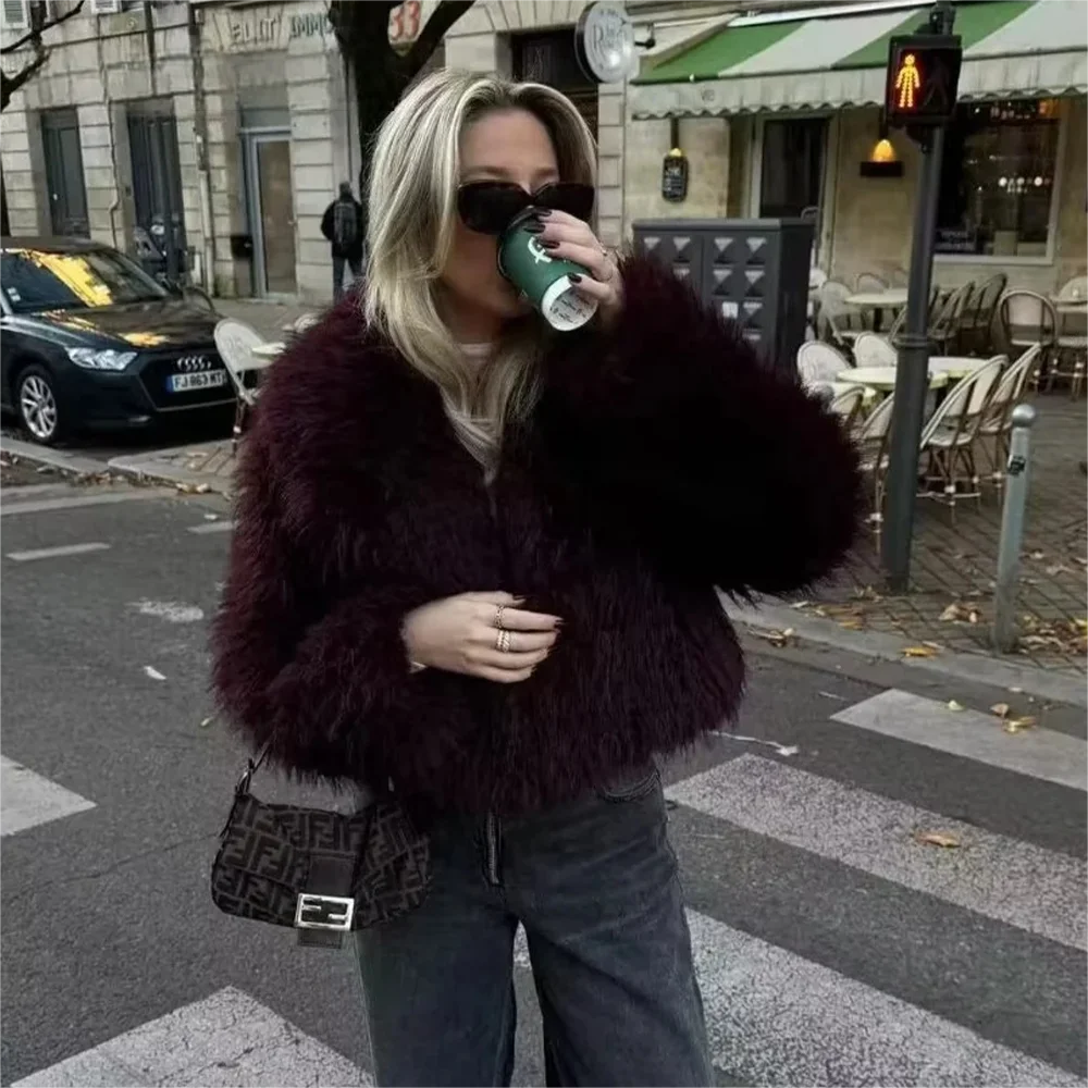 Side view of women’s burgundy plush oversized coat