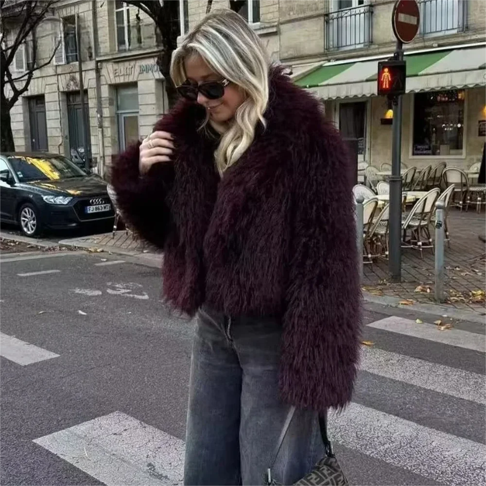 Side view of women’s burgundy plush winter coat