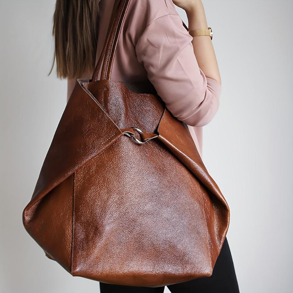 Close-up of premium vegan leather texture and quality hardware on Heather tote bag