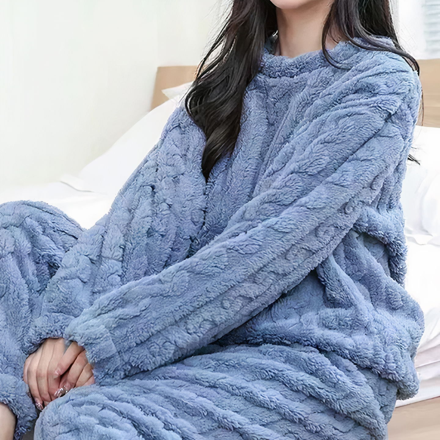 Woman wearing Haven fleece lounge set relaxing at home, cozy two piece pajama sleepwear for winter