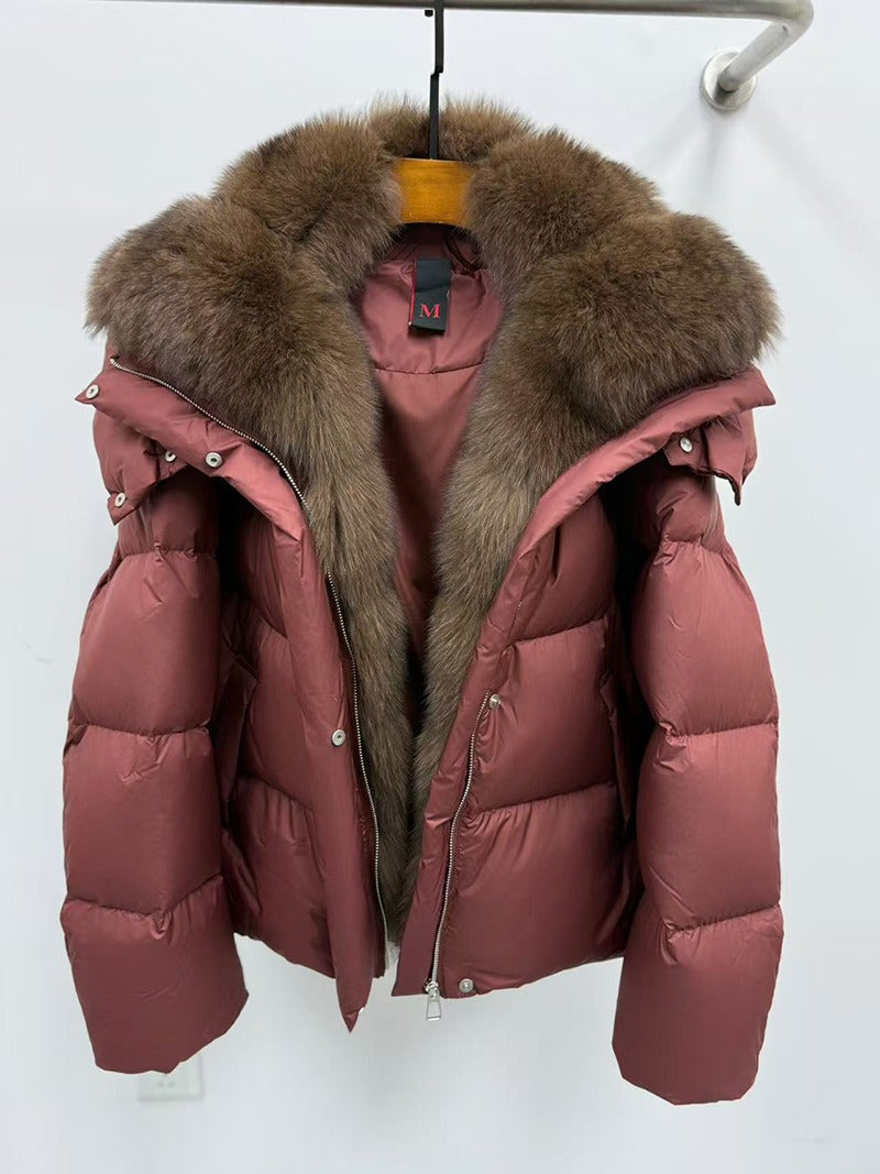 Mauve puffer jacket with fur collar on hanger - product detail shot