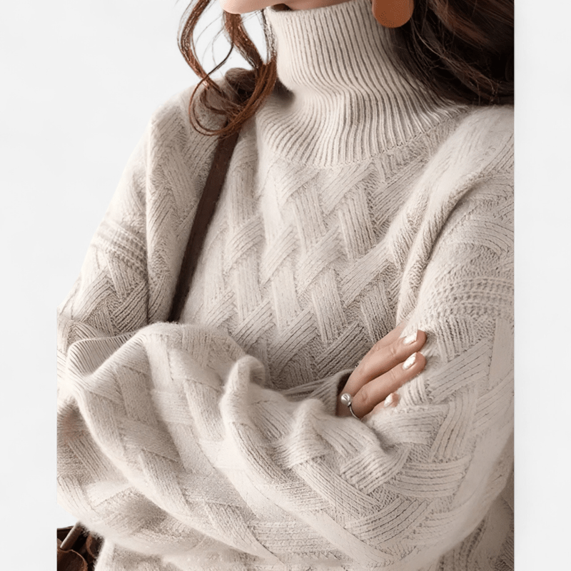 Close-up of a person wearing a carmel knitted sweater