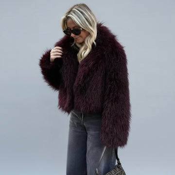 Side view of women’s burgundy plush winter coat