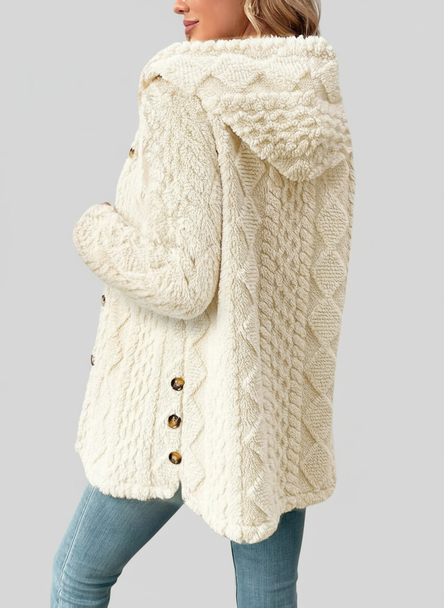 Flat lay of button-up knit cardigan showing texture and design