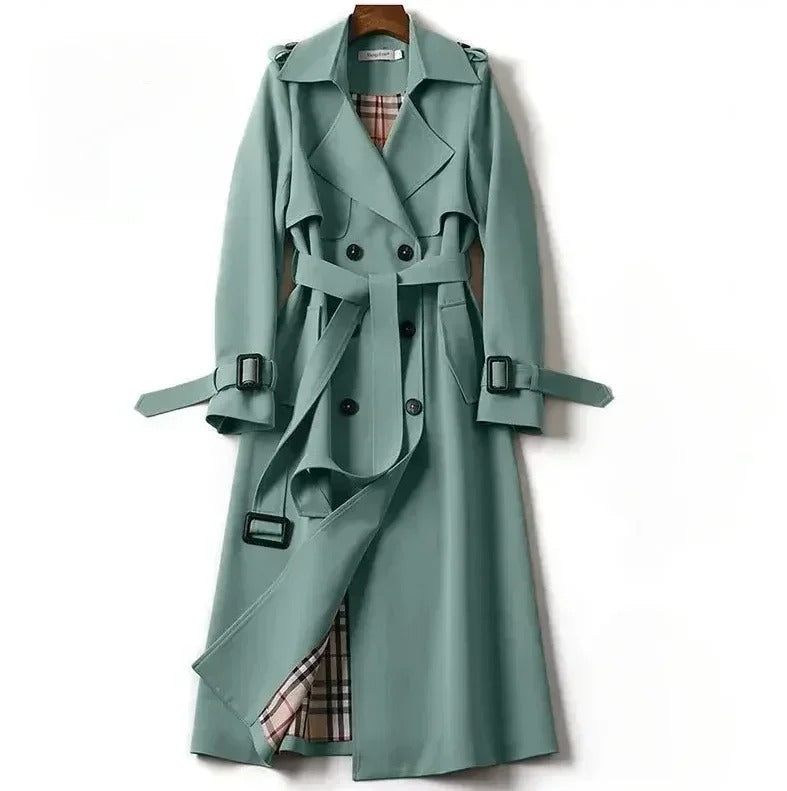 Green trench coat on a white background