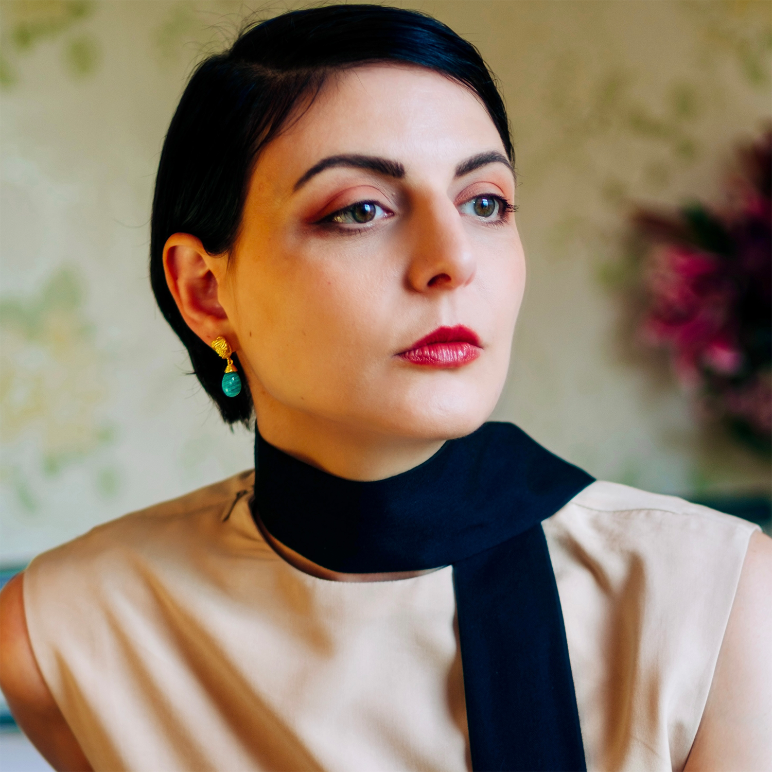 Handcrafted malachite drop earrings in 22 karat gold, artisan gemstone jewellery close-up