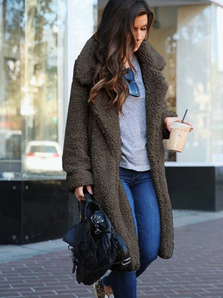 Stylish winter outfit featuring long plush fleece coat