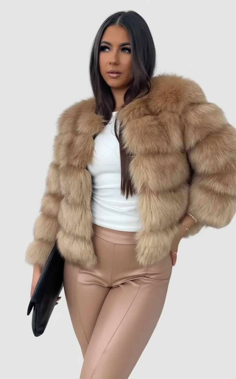 Model wearing faux fur coat