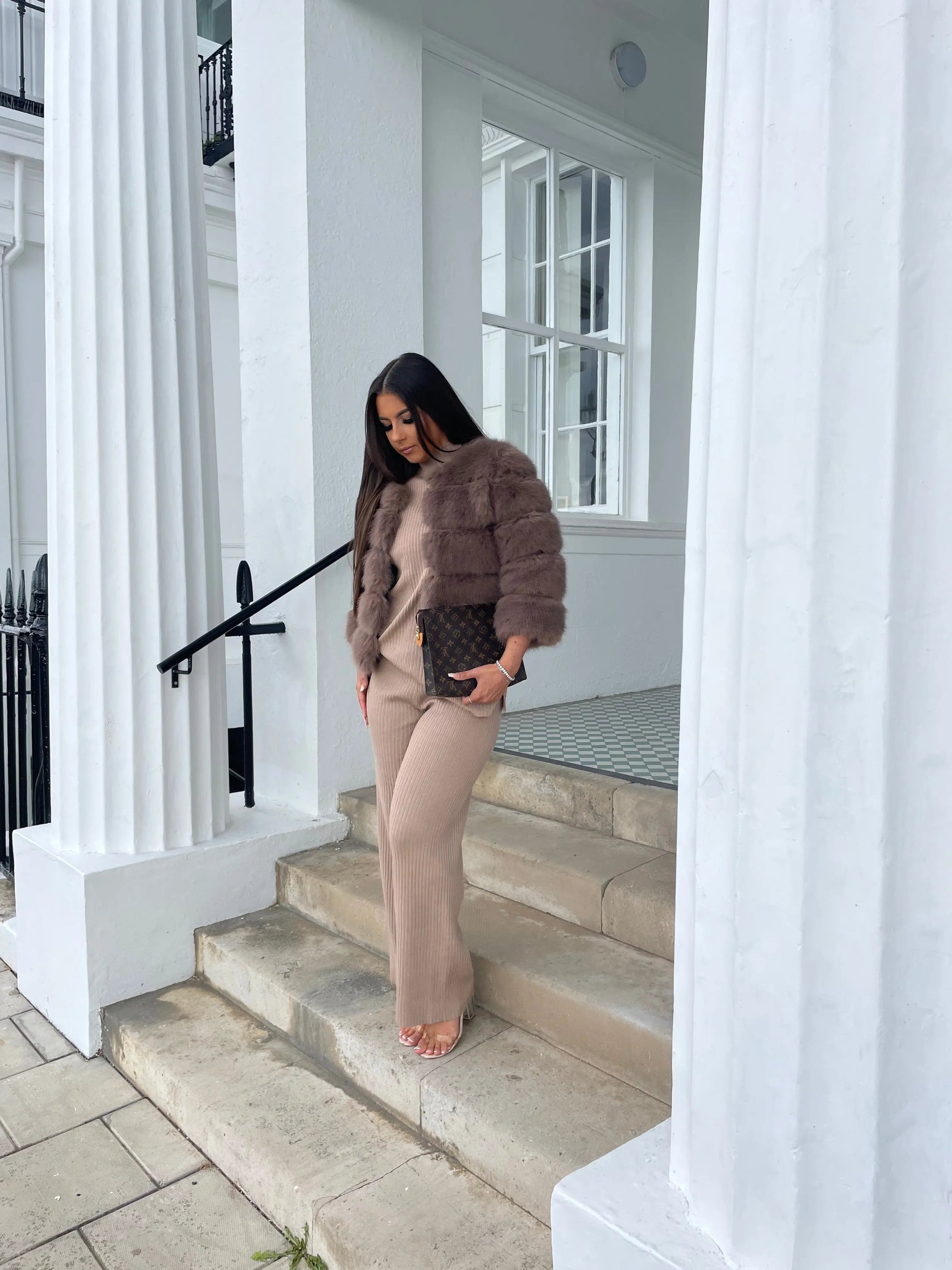 Luxury fashion look with faux fur coat