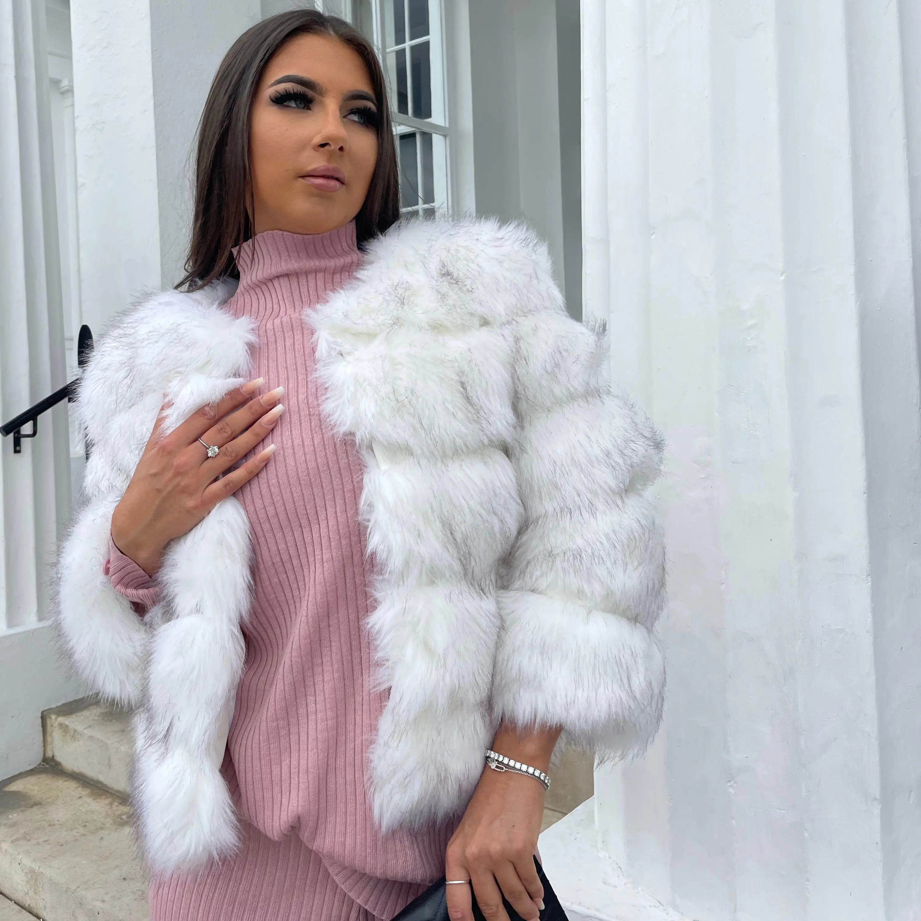 Model wearing faux fur coat