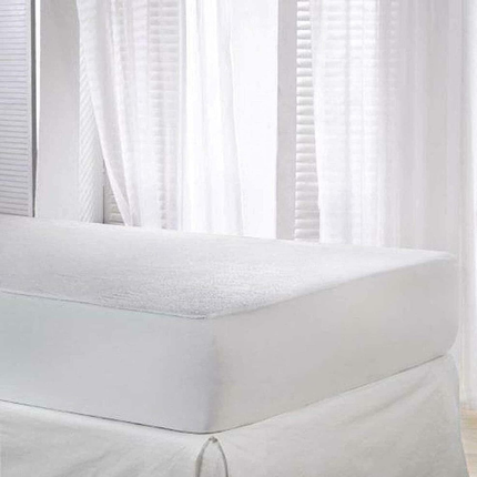 White waterproof terry towel mattress protector on a double bed