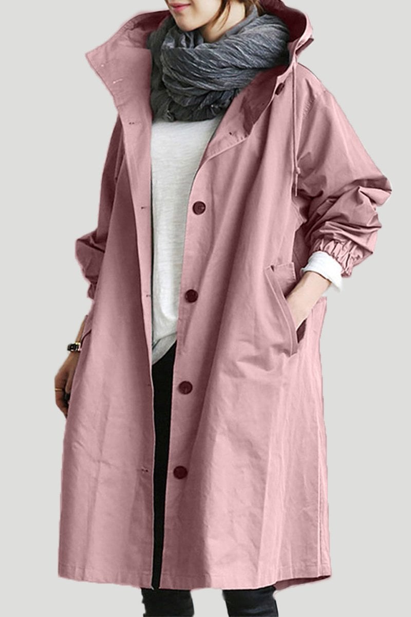Close  up of button and fabric pink womens waterproof trench coat