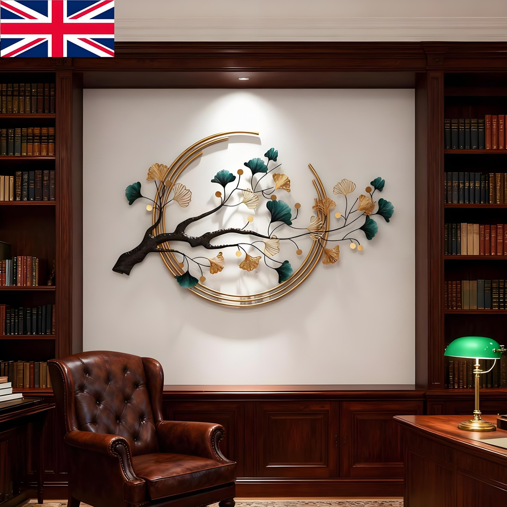 Decorative wall art with floral design in a room with bookshelves and a chair.