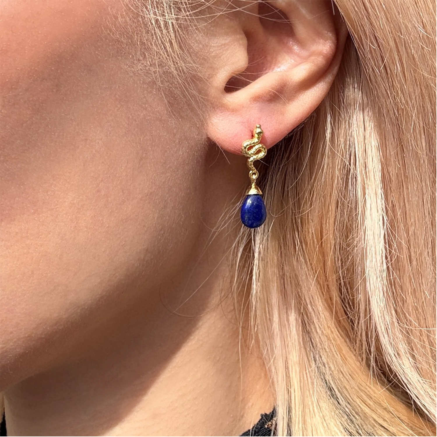 Blue lapis lazuli gemstone earrings with 22k gold plated knot detail and drop design