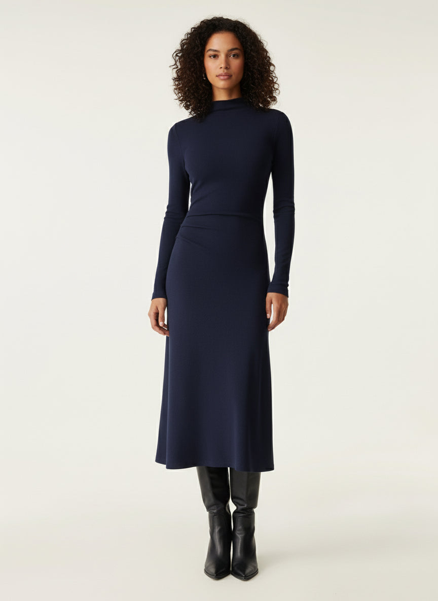 Woman wearing a navy blue dress on a white background