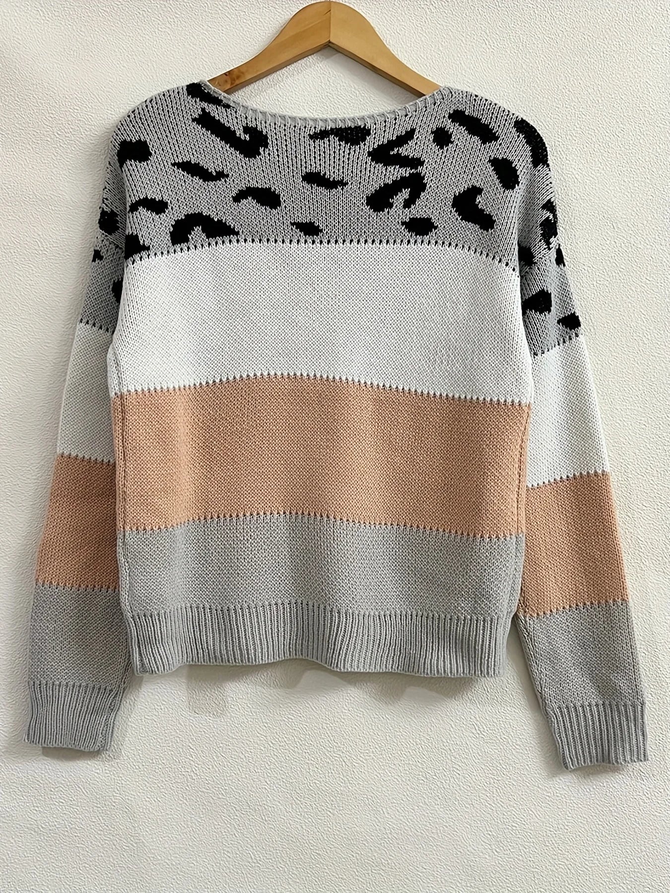 Women’s leopard print pullover styled for winter outfits