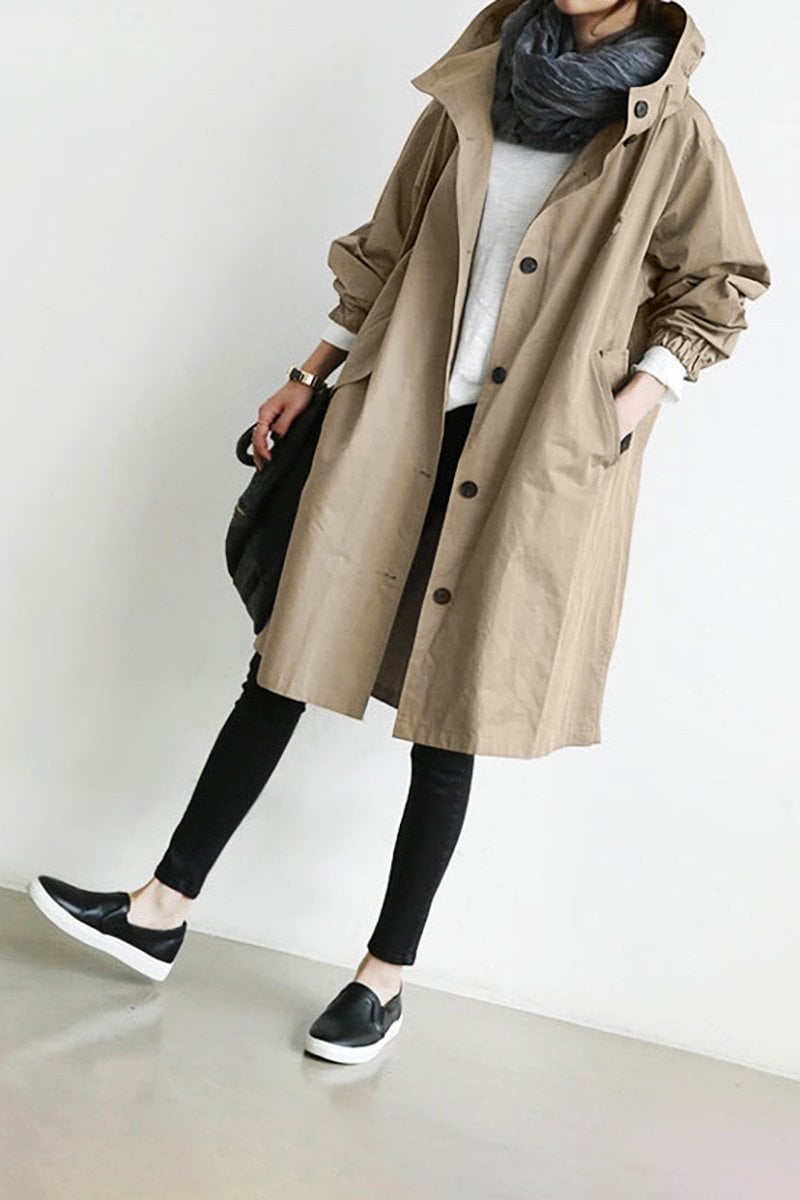 Beige hooded raincoat showing fabric and collar detail